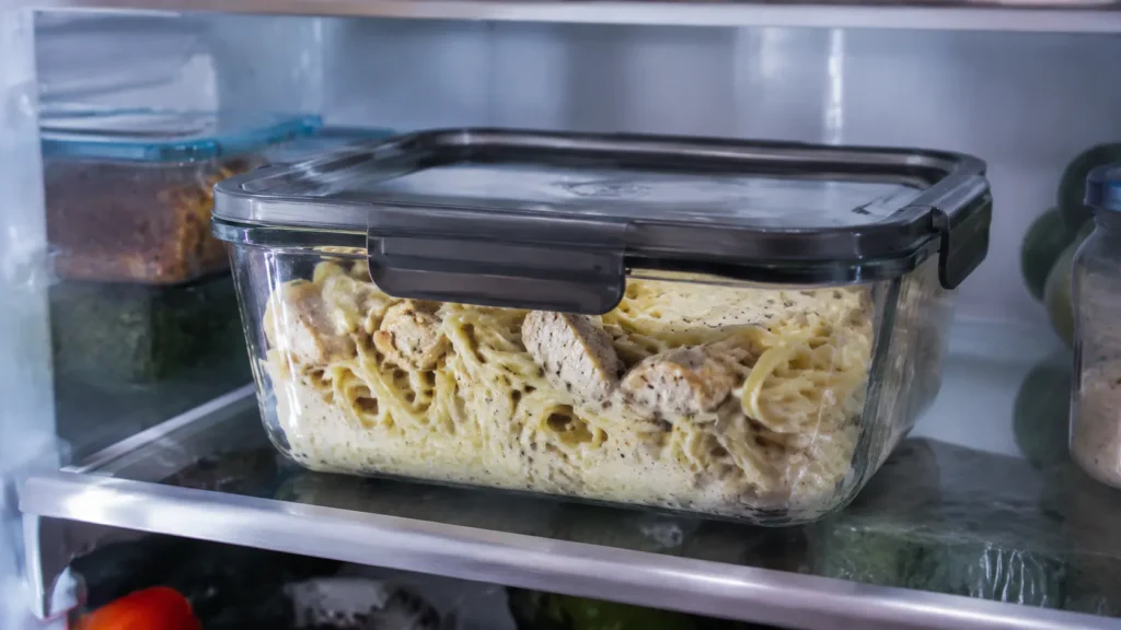 Stored leftover chicken Alfredo in airtight container